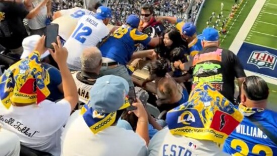 Video from SoFi Stadium showed Rams and Texans fans fighting. A woman was punched and bloodied before security escorted the Texans fans out. (@Brian.bowie43/TikTok)