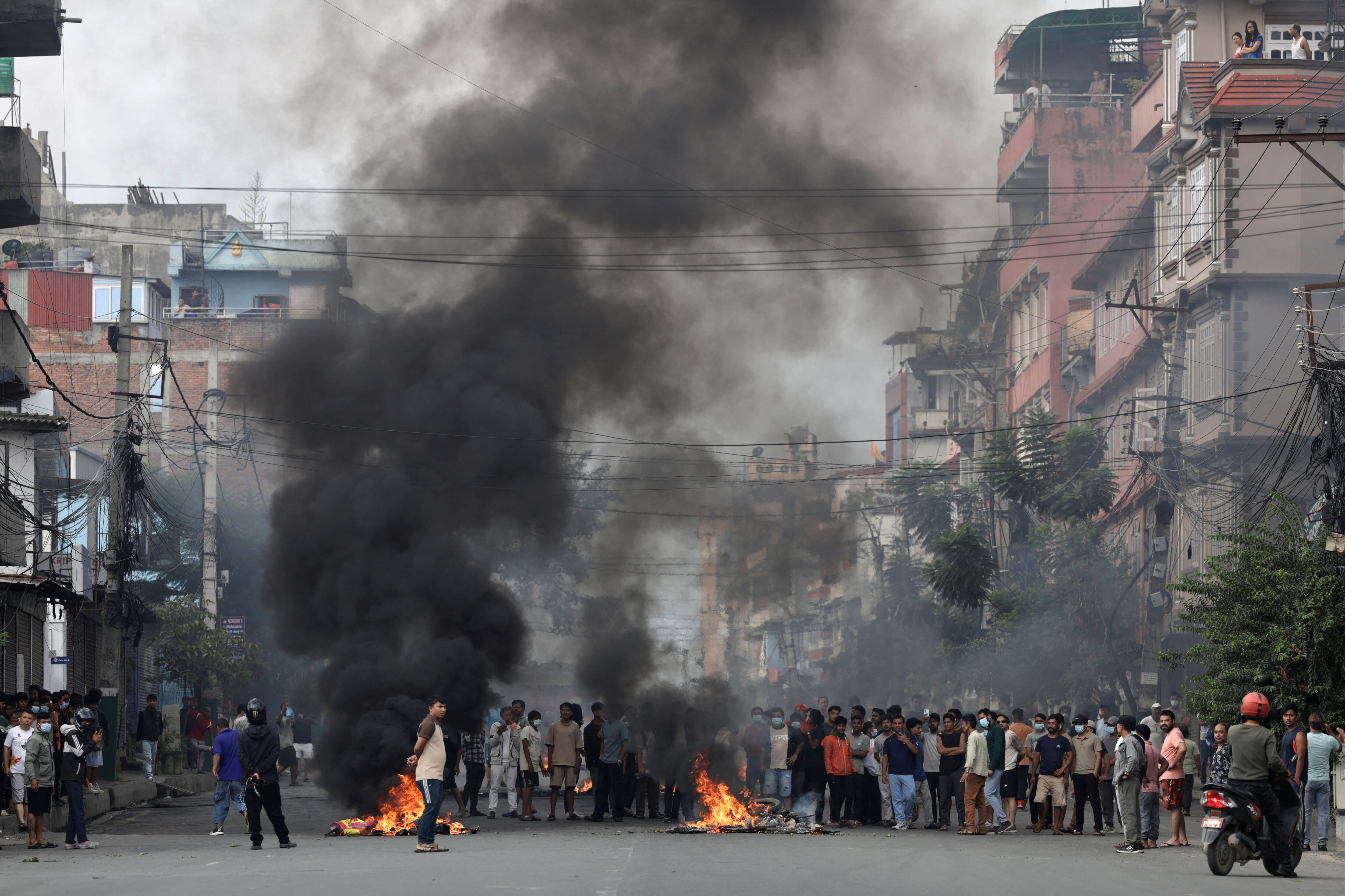 Demonstrators gather to protest during a curfew in Kathmandu, Nepal, on Tuesday. (REUTERS)