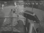 A CCTV video of the incident surfacing on social media shows the man shielding his nephew as the bull charges at them. Locals manage to rescue the kid, but the bull then targets his uncle, chasing and leaving him with multiple injuries. (HT Photos) A CCTV video of the incident surfacing on social media shows the man shielding his nephew as the bull charges at them. Locals manage to rescue the kid, but the bull then targets his uncle, chasing and leaving him with multiple injuries. (HT Photos)