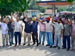 Contractual employees protesting against the state government at ISBT in Ludhiana on Wednesday. (Gurpreet Singh/HT)
