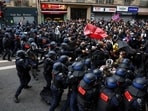 Police officers in riot gear clash with demonstrators gathering during a day of protests as part of a grassroots protest movement called "Bloquons Tout" ("Let's Block Everything") calling for nationwide all-day disruption, in Paris,