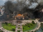 An aerial view of smoke rising from the Federal Parliament of Nepal premises after it was set on fire by protestors during massive anti-government protests, in Kathmandu. An aerial view of smoke rising from the Federal Parliament of Nepal premises after it was set on fire by protestors during massive anti-government protests, in Kathmandu.