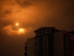 Explosions are seen in the night sky as Ukraine fires at Russian drones during a strike in Kyiv.