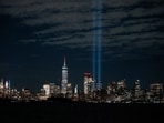 The Tribute in Light installation is illuminated over the lower Manhattan skyline during the testing process before the 24th anniversary of the September 11, 2001, attacks on the World Trade Center, as viewed from Bayonne, New Jersey, U.S. September 9, 2025. REUTERS/Eduardo Munoz