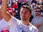 U.S. right-wing activist and commentator Charlie Kirk throws hats to the crowd shortly before he was shot at a Utah Valley University.
