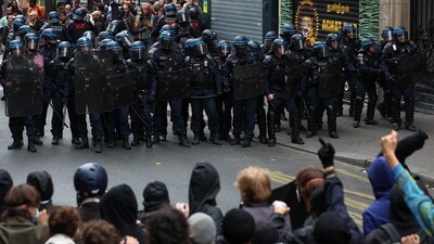 Police officers in Paris block demonstrators who gathered in Paris during nationwide protests, "Bloquons Tout" ("Let's Block Everything"). (Abdul Saboor/REUTERS)