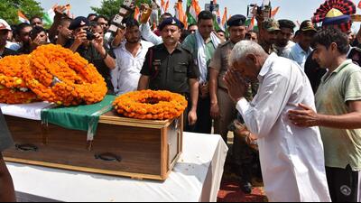 Father of 28-year-old Lance Naik Narender Sindhu, who was killed in an encounter in Kulgam, bids a final adieu to his son. Sindhu was cremated with full military honours in his native village in Kaithal on Wednesday. (HT Photo) Father of 28-year-old Lance Naik Narender Sindhu, who was killed in an encounter in Kulgam, bids a final adieu to his son. Sindhu was cremated with full military honours in his native village in Kaithal on Wednesday. (HT Photo)