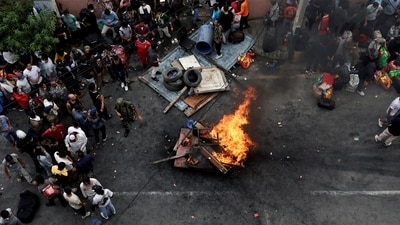 Prisoners burn furniture and other items outside the Dilli Bazaar jail as they try to breakout, following protests against Monday's killing of 19 people after anti-corruption protests triggered by a social media ban which was later lifted, in Kathmandu, Nepal (REUTERS)