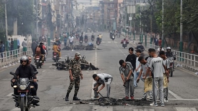 Nepali army soldiers clear debris from a road near the Singha Durbar office complex in Kathmandu, Nepal, September 10, 2025. (Navesh Chitrakar/Reuters)
