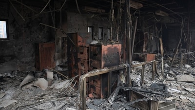 Burnt remains lie inside a section of the Parliament house which was set on fire by the protesters, following Monday's killing of 19 people after anti-corruption protests that were triggered by a social media ban. (Adnan Abidi/Reuters)