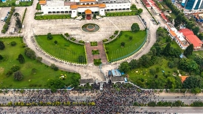 An aerial view shows demonstrators gathered outside Nepal's Parliament (top) during a protest in Kathmandu. (Prabin Ranabhat/AFP)