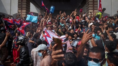 Demonstrators celebrate at the Parliament complex during a protest in Kathmandu. (Adnan Abidi/Reuters)