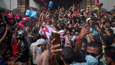 Demonstrators celebrate at the Parliament complex during a protest against Monday's killing of 19 people after anti-corruption protests that were triggered by a social media ban, which was later lifted, during a curfew in Kathmandu, Nepal, September 9, 2025. REUTERS/Adnan Abidi (REUTERS)