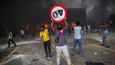 A fire burns inside the Parliament complex during a protest in Nepal's Kathmandu on September 9. (Adnan Abidi/Reuters)