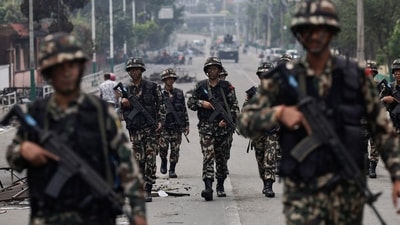 Nepali army soldiers patrol at the road near the Singha Durbar office complex that houses the Prime Minister's office and other ministries in Kathmandu, Nepal, September 10, 2025. (Navesh Chitrakar/Reuters)