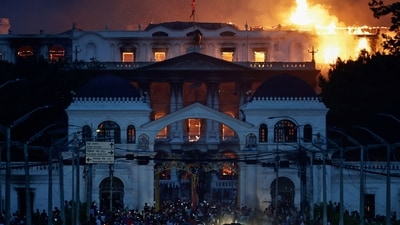 Flames rise from the burning Singha Durbar office complex that houses the Nepali prime minister's office and other ministries. (Navesh Chitrakar/Reuters)