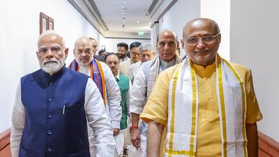 Prime Minister Narendra Modi, union ministers Amit Shah and J.P. Nadda, along with senior National Democratic Alliance (NDA) leaders Sanjay Jha, Ram Mohan Naidu, and Shrikant Shinde, called on Radhakrishnan on Tuesday night. (narendramodi.in) Prime Minister Narendra Modi, union ministers Amit Shah and J.P. Nadda, along with senior National Democratic Alliance (NDA) leaders Sanjay Jha, Ram Mohan Naidu, and Shrikant Shinde, called on Radhakrishnan on Tuesday night. (narendramodi.in)