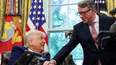 Britain's ambassador to the United States, Peter Mandelson, shakes hands with  Donald Trump after announcing a trade deal with the U.K., in the Oval Office at the White House in Washington, D.C., U.S., May 8, 2025. REUTERS/Leah Millis/File Photo (REUTERS)