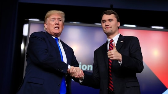 President Donald Trump shakes hands with moderator Charlie Kirk, during a Generation Next White House forum at the Eisenhower Executive Office Building on the White House complex in Washington, Thursday, March 22, 2018. (AP)