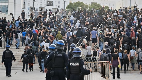 Police personnel disperse crowds of demonstrators in Marseille during nationwide protests in France.(AP)
