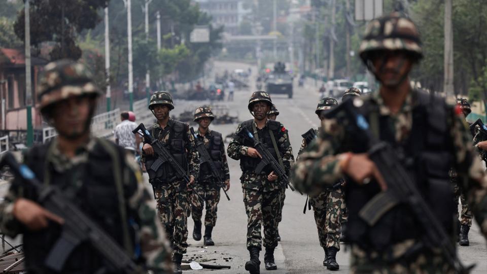 Nepali army soldiers patrol at the road near the Singha Durbar office complex that houses the Prime Minister’s office and other ministries, following protests against Monday’s killing of 19 people (REUTERS) Nepali army soldiers patrol at the road near the Singha Durbar office complex that houses the Prime Minister’s office and other ministries, following protests against Monday’s killing of 19 people (REUTERS)