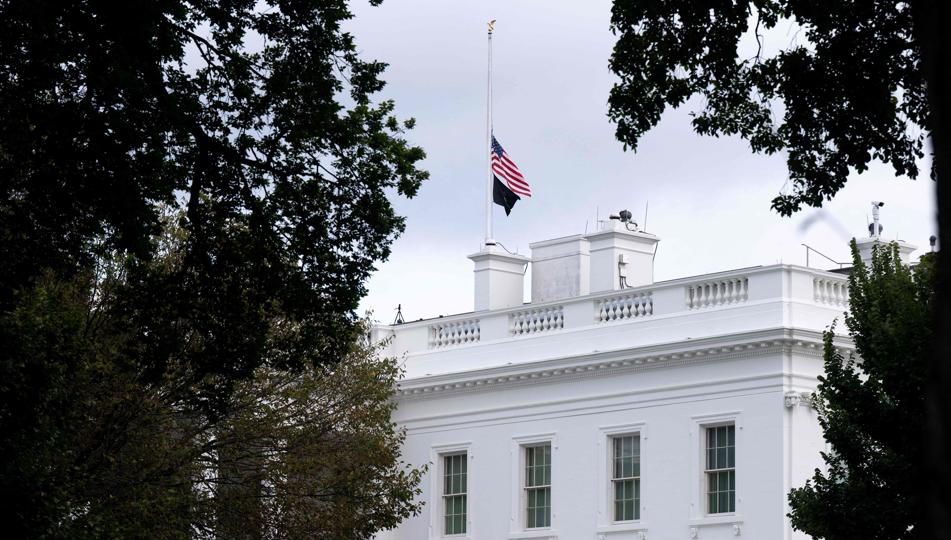 The US flag flies at half-staff on the roof of the White House in honour of conservative commentator Charlie Kirk who was shot and killed earlier today in Utah, in Washington, DC (AFP)