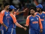India's Kuldeep Yadav, second right, celebrates the wicket of United Arab Emirates's Rahul Chopra during the Asia Cup.