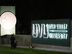 A person takes a photo of flowers in front of a campus sign at Utah Valley University after Charlie Kirk was shot and killed, Thursday, Sept. 11, 2025, in Orem, Utah. A person takes a photo of flowers in front of a campus sign at Utah Valley University after Charlie Kirk was shot and killed, Thursday, Sept. 11, 2025, in Orem, Utah.