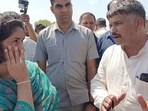 Congress legislator from Julana, Vinesh Phogat interacting with Buwana village sarpanch Sudhir on Thursday. (HT Photo)
