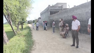 ​ Bathinda Police outside the house in Jeeda village in Bathinda on Thursday. (Sanjeev Kumar/HT)