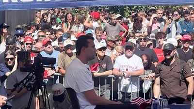 Charlie Kirk was shot during a public event at Utah Valley University on September 10, 2025. A viral video shows people stealing hats from the event post the shooting. (AFP) Charlie Kirk was shot during a public event at Utah Valley University on September 10, 2025. A viral video shows people stealing hats from the event post the shooting. (AFP)