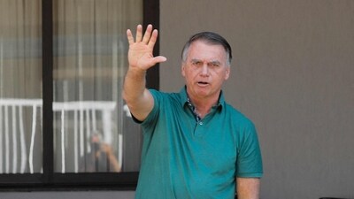 Former Brazilian President Jair Bolsonaro waves at the garage of his residence in Brasilia on September 11, 2025. (AFP) Former Brazilian President Jair Bolsonaro waves at the garage of his residence in Brasilia on September 11, 2025. (AFP)