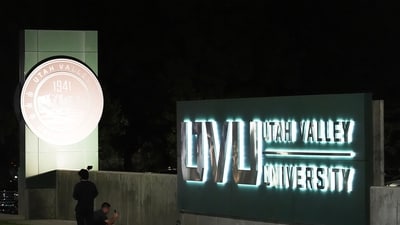 A person takes a photo of flowers in front of a campus sign at Utah Valley University after Charlie Kirk was shot and killed, Thursday, Sept. 11, 2025, in Orem, Utah. (AP) A person takes a photo of flowers in front of a campus sign at Utah Valley University after Charlie Kirk was shot and killed, Thursday, Sept. 11, 2025, in Orem, Utah. (AP)