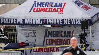 A police officer walks past a tent bearing the slogan 'The American Comeback Tour', cordoned off after US right-wing activist and commentator Charlie Kirk was shot dead. Dressed in a white t-shirt with the word "Freedom" across the front, Kirk had been seated under the tent answering questions from a large audience before the attack. (REUTERS)