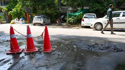 Foul water from a blocked drain has flooded an entire road in the colony, said residents. (Vipin Kumar/HT Photo) Foul water from a blocked drain has flooded an entire road in the colony, said residents. (Vipin Kumar/HT Photo)
