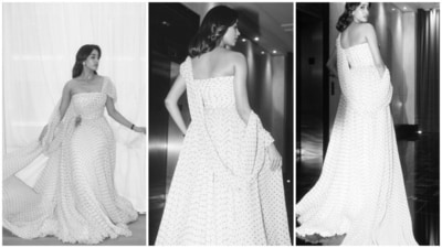 Janhvi donned a custom Miu Miu saree-inspired gown with a one-shoulder design and golden brooch, exuding elegance and glamour. 