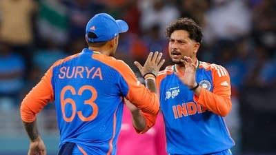 India's Kuldeep Yadav celebrates with captain Suryakumar Yadav (Creimas/Asian Cricket Council) India's Kuldeep Yadav celebrates with captain Suryakumar Yadav (Creimas/Asian Cricket Council)