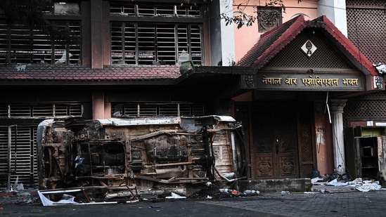 A torched government building is pictured during a curfew imposed to restore law and order in Nepal's Kathmandu on Thursday. A torched government building is pictured during a curfew imposed to restore law and order in Nepal's Kathmandu on Thursday.