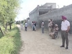 ​ Bathinda Police outside the house in Jeeda village in Bathinda on Thursday. (Sanjeev Kumar/HT)