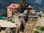 A truck hangs precariously from the edge of a road after a landslide at Sangla, in Kinnaur district, Himachal Pradesh, on Friday. (PTI) A truck hangs precariously from the edge of a road after a landslide at Sangla, in Kinnaur district, Himachal Pradesh, on Friday. (PTI)