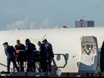 The body of slain conservative activist Charlie Kirk is carried from Air Force Two