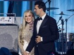 Charlie Kirk (R) and and his wife Erika Lane Frantzve (L) on stage during the Turning Point USA Inaugural-Eve Ball Charlie Kirk (R) and and his wife Erika Lane Frantzve (L) on stage during the Turning Point USA Inaugural-Eve Ball