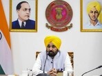 Punjab chief minister Bhagwant Mann virtually chairing a high-level meeting with the state’s deputy commissioners, chief secretary and other senior officials from various departments in Chandigarh on Friday to review the flood situation in the state. (PTI Photo) Punjab chief minister Bhagwant Mann virtually chairing a high-level meeting with the state’s deputy commissioners, chief secretary and other senior officials from various departments in Chandigarh on Friday to review the flood situation in the state. (PTI Photo)