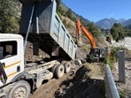 Restoration work underway on the Manali Chandigarh NH in Manali on Thursday. (Aqil Khan /HT)