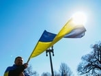 A demonstrator holds a Ukrainian flag during a "Stand with Ukraine" rally against the Russian invasion of Ukraine, in front of the White House in Washington, U.S. 