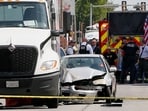 Police officers and first responders work at the scene after a U.S. Immigration and Customs Enforcement (ICE) agent shot and killed a man as officers attempted to detain him, according to the Department of Homeland Security, in Franklin Park village, northwest of Chicago, in Cook County, Illinois.