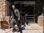 An Israeli border guard walks out of the scene of a stabbing attack in Tzuba (Tzova), on the western outskirts of Jerusalem, on Friday.