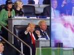 Donald Trump, in his signature suit and tie, was seated next to Yankees team president Randy Levine and chatted with him throughout the game. Donald Trump, in his signature suit and tie, was seated next to Yankees team president Randy Levine and chatted with him throughout the game.