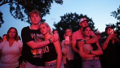 Utah Valley University students Zach Zimmerman, second from left, and Lauren Simons embrace during a vigil for Charlie Kirk, the CEO and co-founder of Turning Point USA who was shot and killed, Thursday, Sept. 11, 2025, in Orem, Utah. Zimmerman witnessed the shooting. (AP Photo/Lindsey Wasson) (AP) Utah Valley University students Zach Zimmerman, second from left, and Lauren Simons embrace during a vigil for Charlie Kirk, the CEO and co-founder of Turning Point USA who was shot and killed, Thursday, Sept. 11, 2025, in Orem, Utah. Zimmerman witnessed the shooting. (AP Photo/Lindsey Wasson) (AP)
