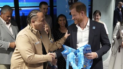 Prince Harry, Duke of Sussex is gifted a bag of childrens' activities during a visit to take part in a panel discussion on how social action positively impacts mental health with four young people who are involved with The Diana Award, in Salisbury Square, central London. Picture date: Thursday September 11, 2025.    Aaron Chown/Pool via REUTERS (via REUTERS)